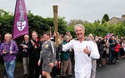 The Olympic flame passes through